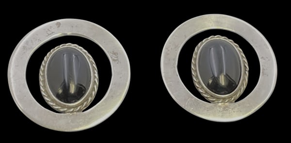 Pair of Mexican Sterling Silver & Black Onyx Earrings in Mid-Century Modern Style: Pair of Mexican sterling silver and black onyx earrings in Mid-Century Modern style. They measure 1 1/4'' in diameter and bear hallmarks as shown.