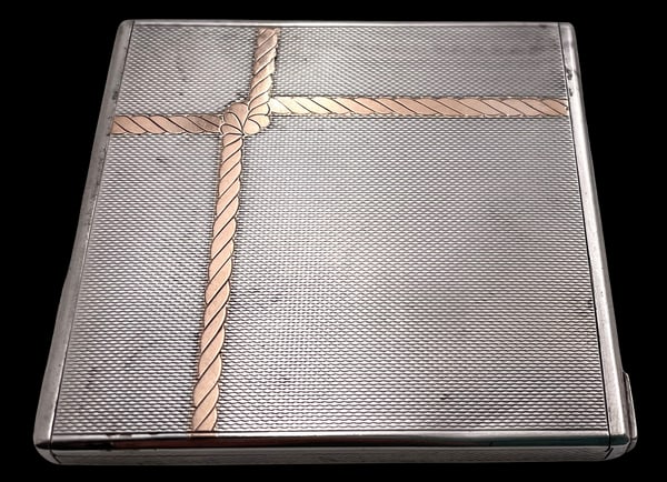 Austrian Sterling Silver Compact with Gold Inlaid & Mirror Engine Turned: Austrian sterling silver compact, inlaid with a gold rope motif at the top, with engine turned decoration, with a mirror inside. It measures 3'' by 2 3/4'' by 1/3'', weighs 4 troy ounces, and bears ha