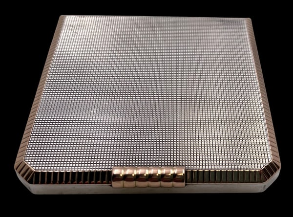 Swedish Silver Compact with Gold Inlaid Engined Turned in Art Deco Style: Swedish silver compact with a gold rim, with exquisite engine turned decoration and a mirror inside, and in Art Deco style with an elegant, geometric design. It measures 2 2/3'' by 2 3/4'' by 1/2'', w