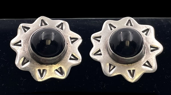 Anna Harvey Pair of Mexican Sterling Silver & Black Onyx Starburst Earrings: Pair of Anna Harvey, Mexican sterling silver and black onyx starburst-shaped earrings, in an elegant, geometric style. They measure 1 1/8'' in diameter by 1/3'' in depth and bear hallmarks as shown.