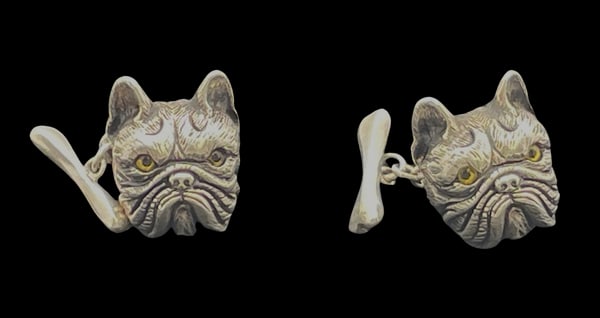 Pair of Sterling Silver Bulldog Cufflinks with Emeralds: Pair of sterling silver bulldog cufflinks, with inlaid eyes and emeralds as dog collars, made in a very realistic manner. They measure 2/3'' from ear to mouth, weigh 0.6 troy ounce, and bear hallmarks