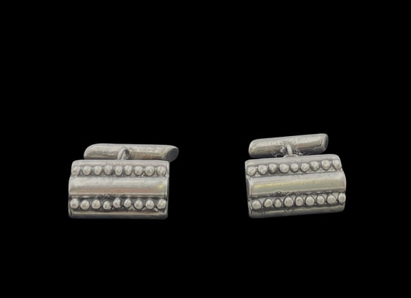 Pair of Mexican Sterling Silver Cufflinks: Pair of Mexican sterling silver cufflinks, with an elegant, geometric design. They measure 3/4'' by 1/3'' and bear hallmarks as shown.