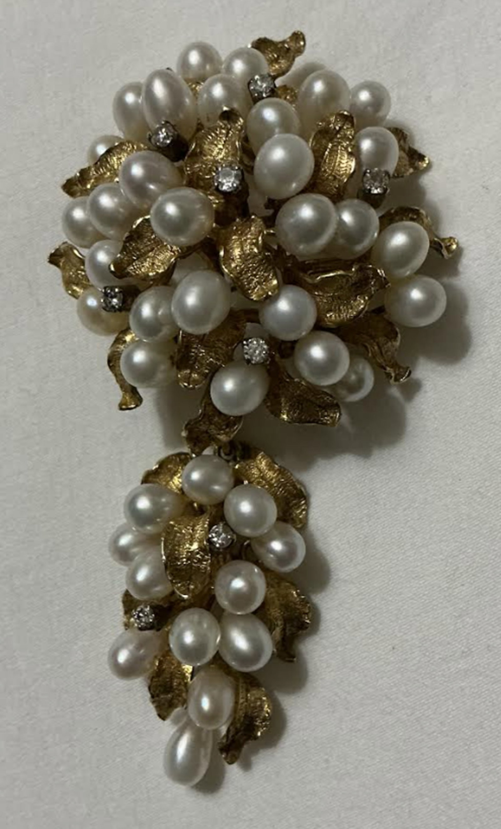 14k Gold, Cultured Pearl, and Diamond Brooch / Pendant, With Removable Drop Pendant: 14k Gold, Cultured Pearl, and Diamond Brooch, with removable drop, 16.4 dwt, lg. 1 1/2 in. The ring has a center pearl approx. 7 mm, and accented with round brilliant cut diamonds, total estimated dia