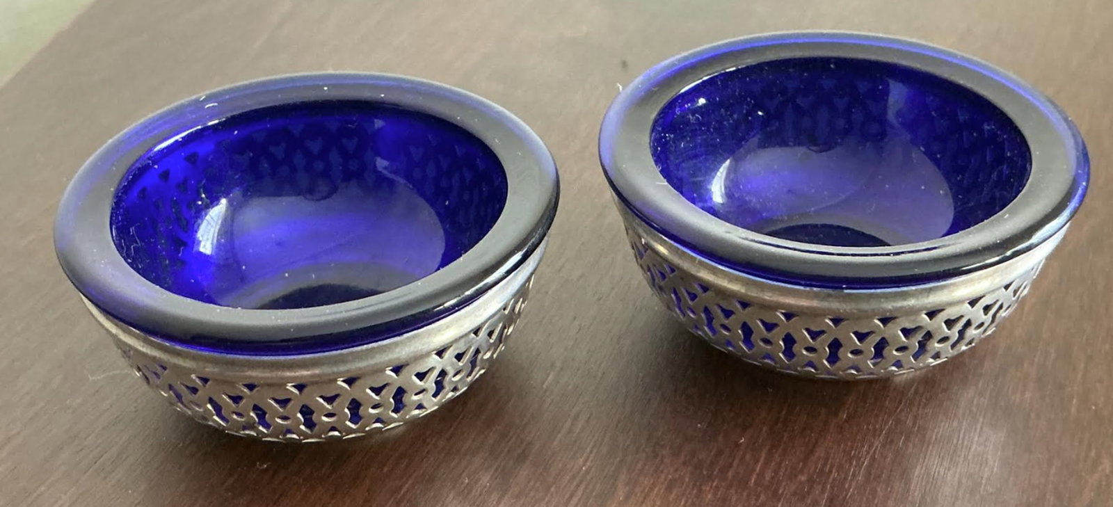 Webster Sterling Silver and Cobalt Blue Salt Cellars: Webster Sterling Silver and Cobalt Blue Salt Cellars Measures approx approx 2 inches diam and 1 inch tall no chips or cracks present