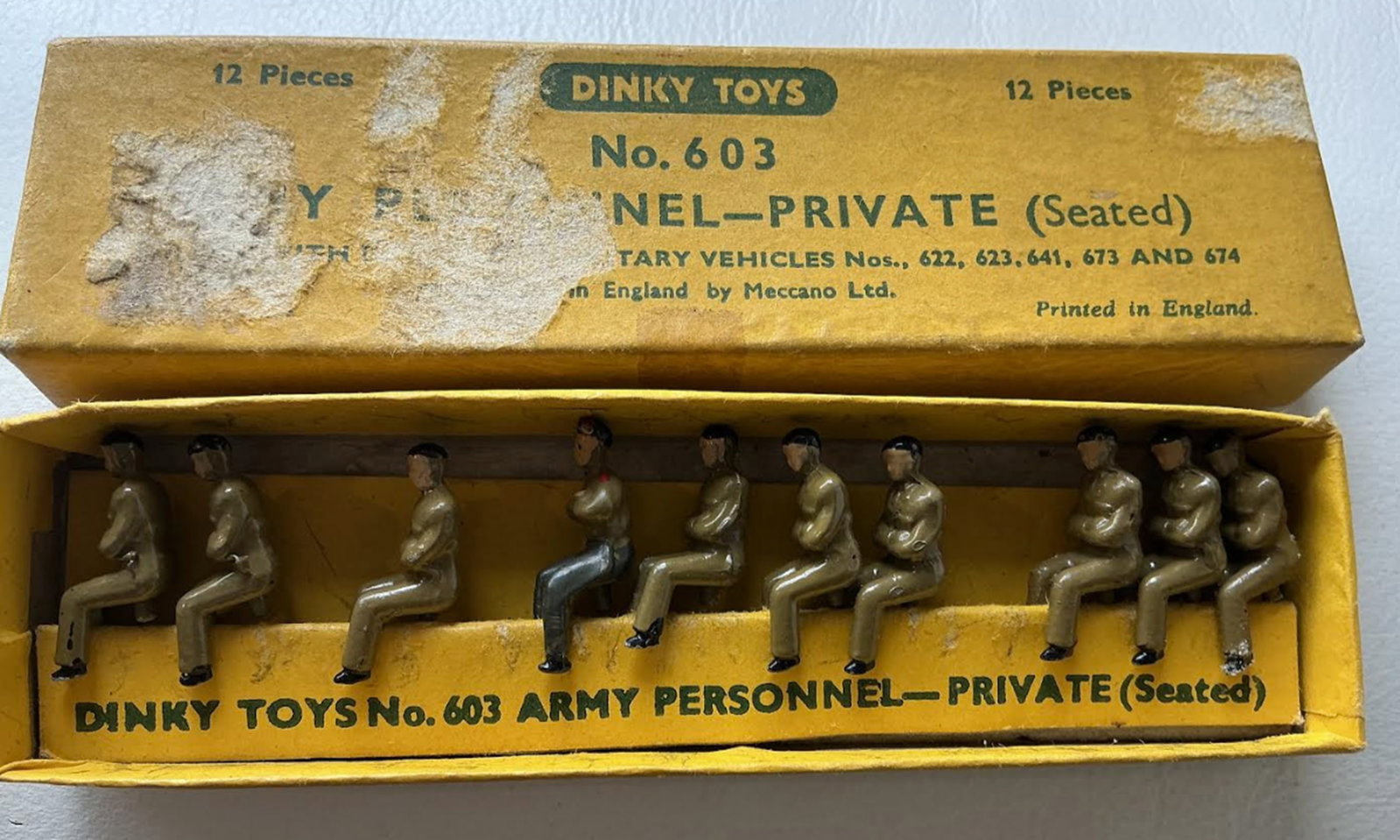 Dinky Toys Army Personnel-Private (Seated) No. 603 with Nine pieces inside for Military Vehicles. (1 of 6)