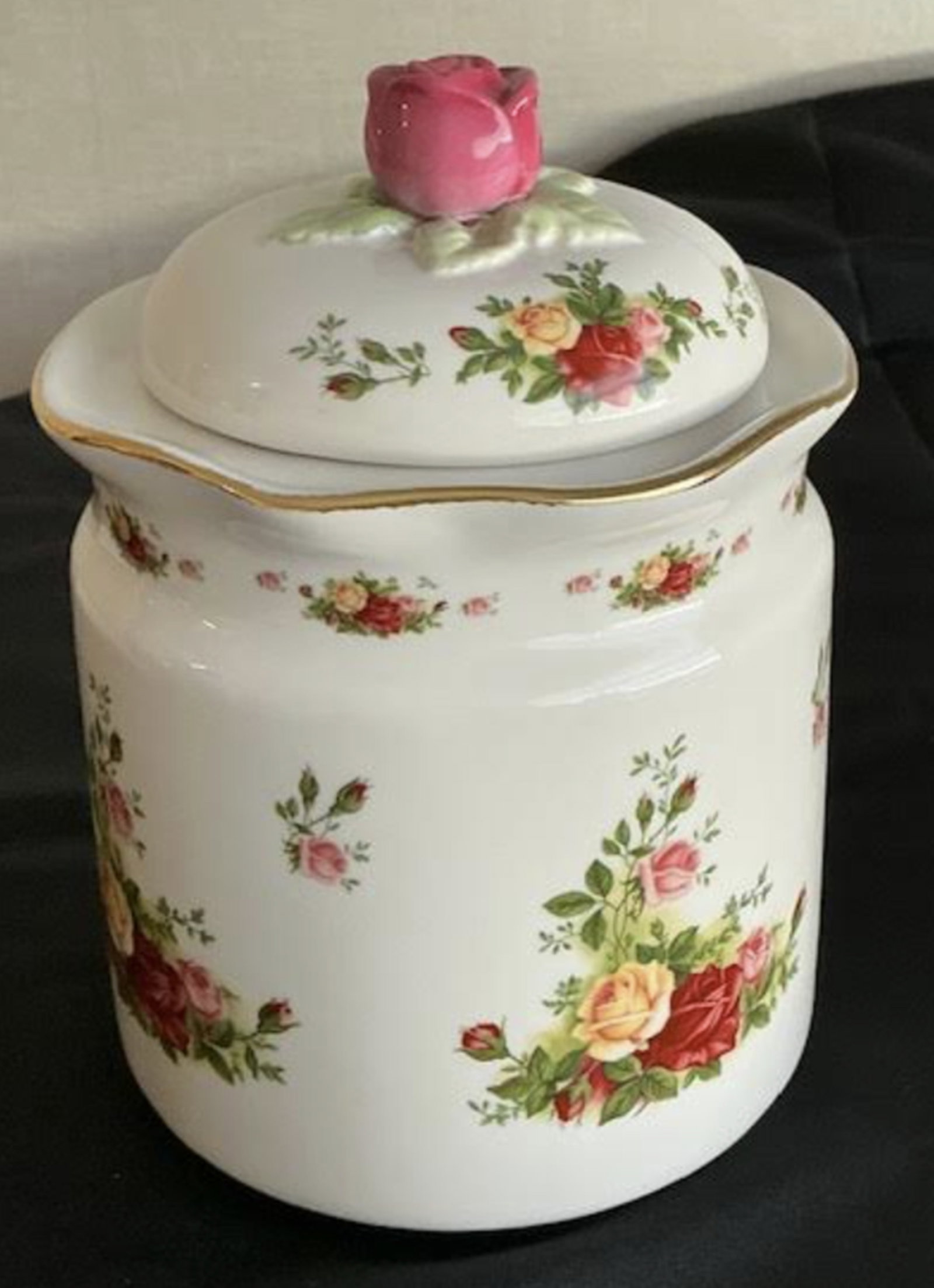 Royal Albert Porcelain Caister: Royal Albert Porcelain Canister Measures approx 5.5 inches accross 8.5 inches tall The lid show a grain crack otherwise great condition