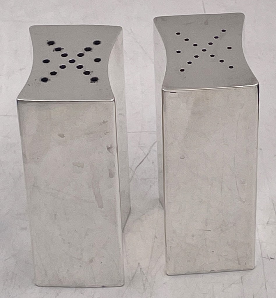 Allan Adler Sterling Silver Large Salt & Pepper Shakers in Mid-Century Modern Style: Pair of Allan Adler sterling silver salt and pepper shakers in Mid-Century Modern style, with an elegant, geometric design. They measure approx. 3'' in height by 1 1/2'' in depth by 1 1/4'' in width a