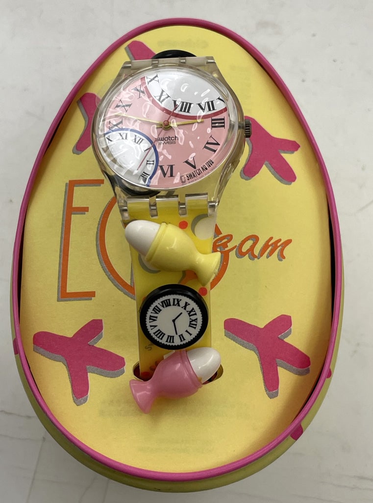 Swatch Eggs Dream Watch New in Box: Eggs Dream Swatch watch, with whimsical design. New with tags in box as shown. The watch measures approx. 1 1/2'' in diameter.