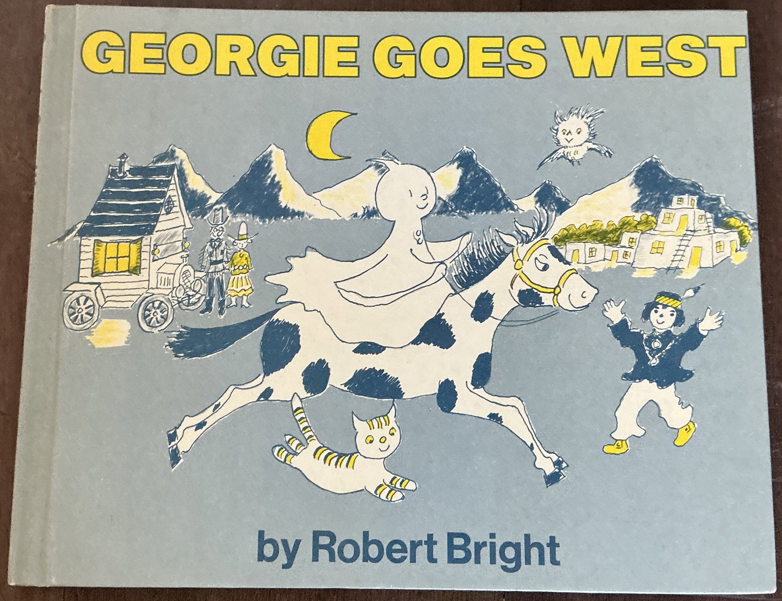 Georgie Goes West Hard Cover Book by Robert Bright 1973: Georgie Goes West Hard Cover Book by Robert Bright 1973 is a classic vintage children’s book featuring the beloved little ghost character Georgie, originally created by author and illustrator Robert