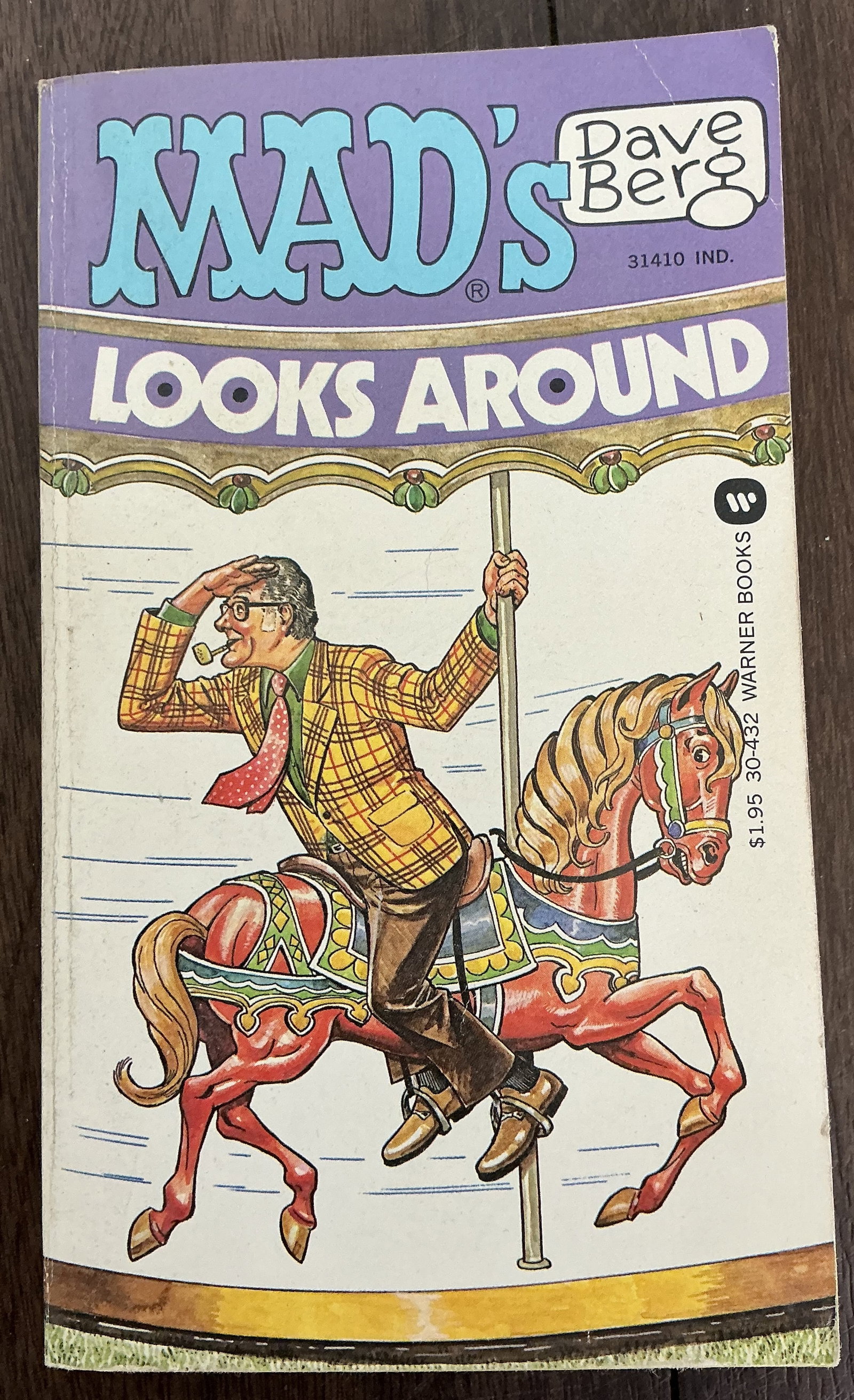 Warner Books Mad’s Dave Berg Looks Around: Warner Books Mad’s Dave Berg Looks Around is a vintage humor paperback featuring the work of Dave Berg, one of the longtime contributors to MAD Magazine. Published by Warner Books, this collection s