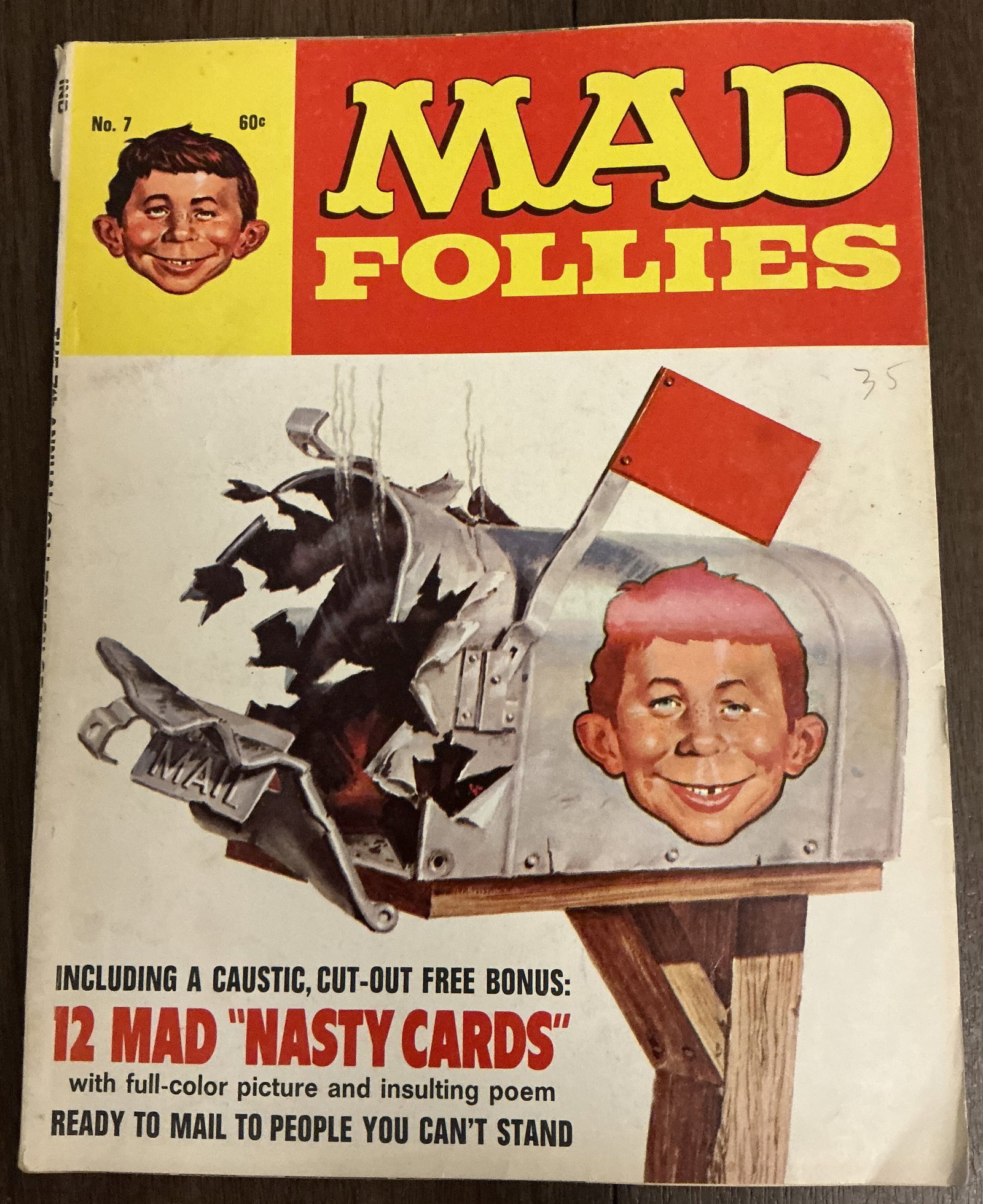 MAD Follies No. 7: MAD Follies No. 7 is a vintage humor magazine from the classic MAD publishing era featuring Alfred E. Neuman on the cover and satirical comedy content typical of the magazine’s peak popularity perio