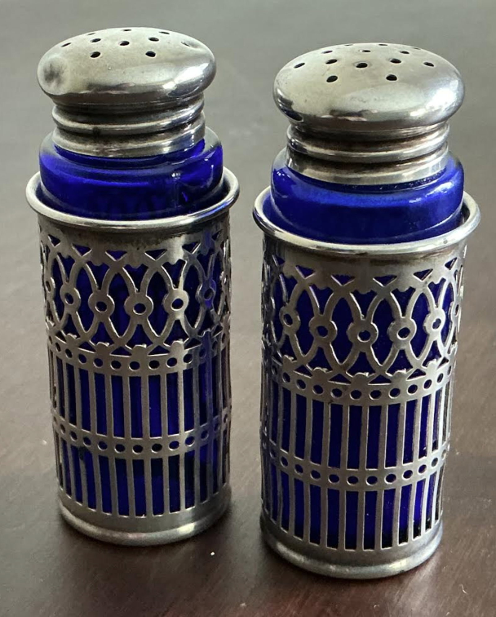 Webster Sterling Silver and Cobalt Blue Salt And Pepper Shakers: Webster Sterling Silver and Cobalt Blue Salt And Pepper Shakers. Measures approx 2 3/4 inches tall x 1 inch diameter.No Chips or cracks present