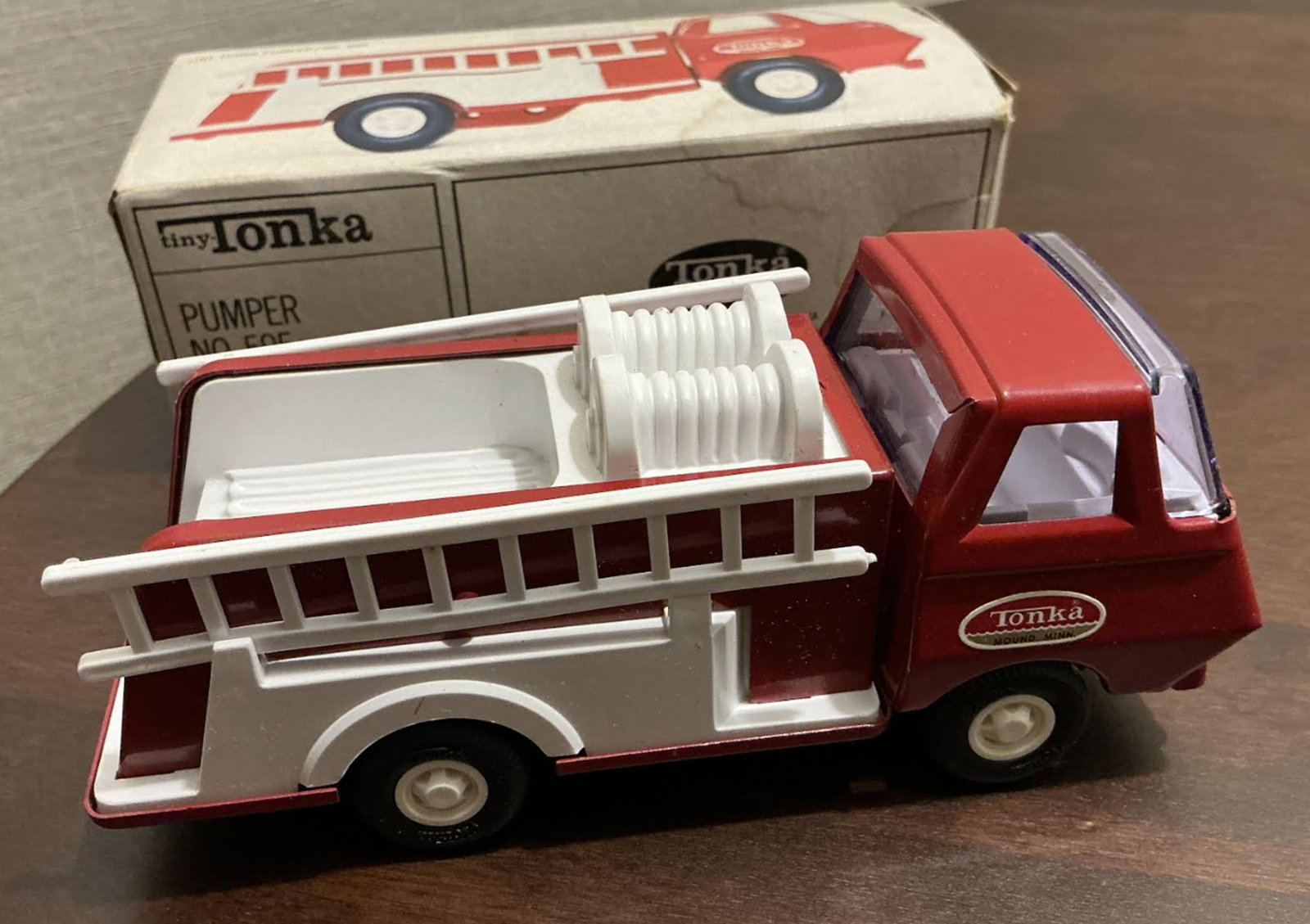 Tiny Tonka Dump Fire Pumer Truck 595 With Orig Box Metal 1970s: Tiny Tonka Dump Fire Pumer Truck 595 With Orig Box Metal 1970s. Box have some signs of age. Measures approx inches long