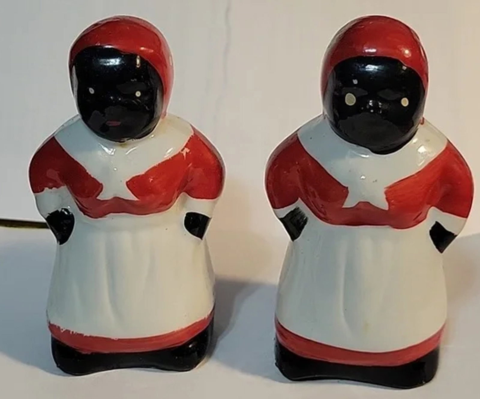 Black americana salt and pepper shaker set: Measures approx 4" tall x 2.25 wide. No Chips or cracks