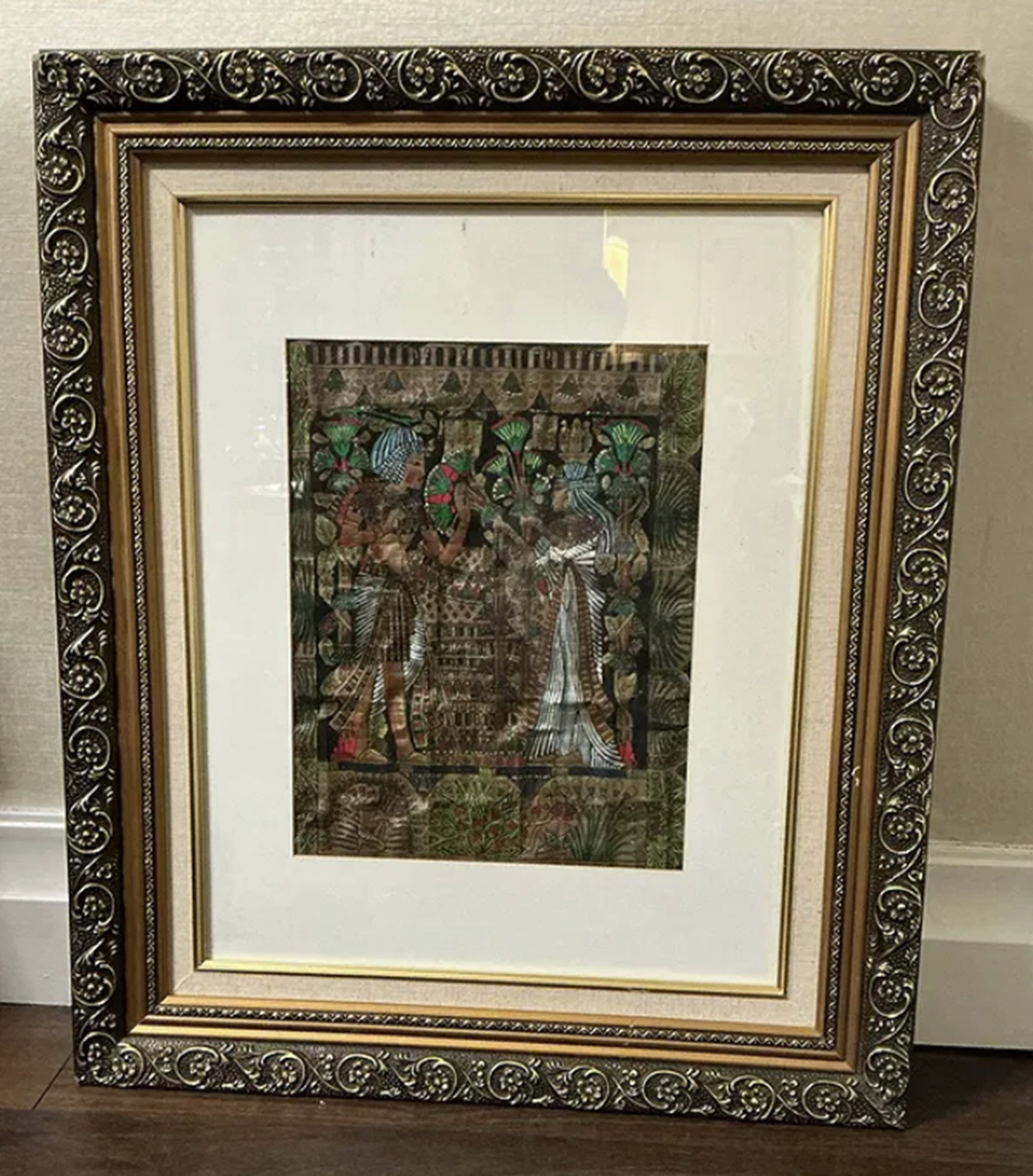 Framed Egyptian papyrus painting depicting the wedding scene of King Tutankhamun and Ankhesenamun: Framed Egyptian papyrus painting depicting the wedding scene of King Tutankhamun and Ankhesenamun. Frame Measures approx 22 inches wide X 26 inches high. art measures approx 10.5 inches x 13.5 inches