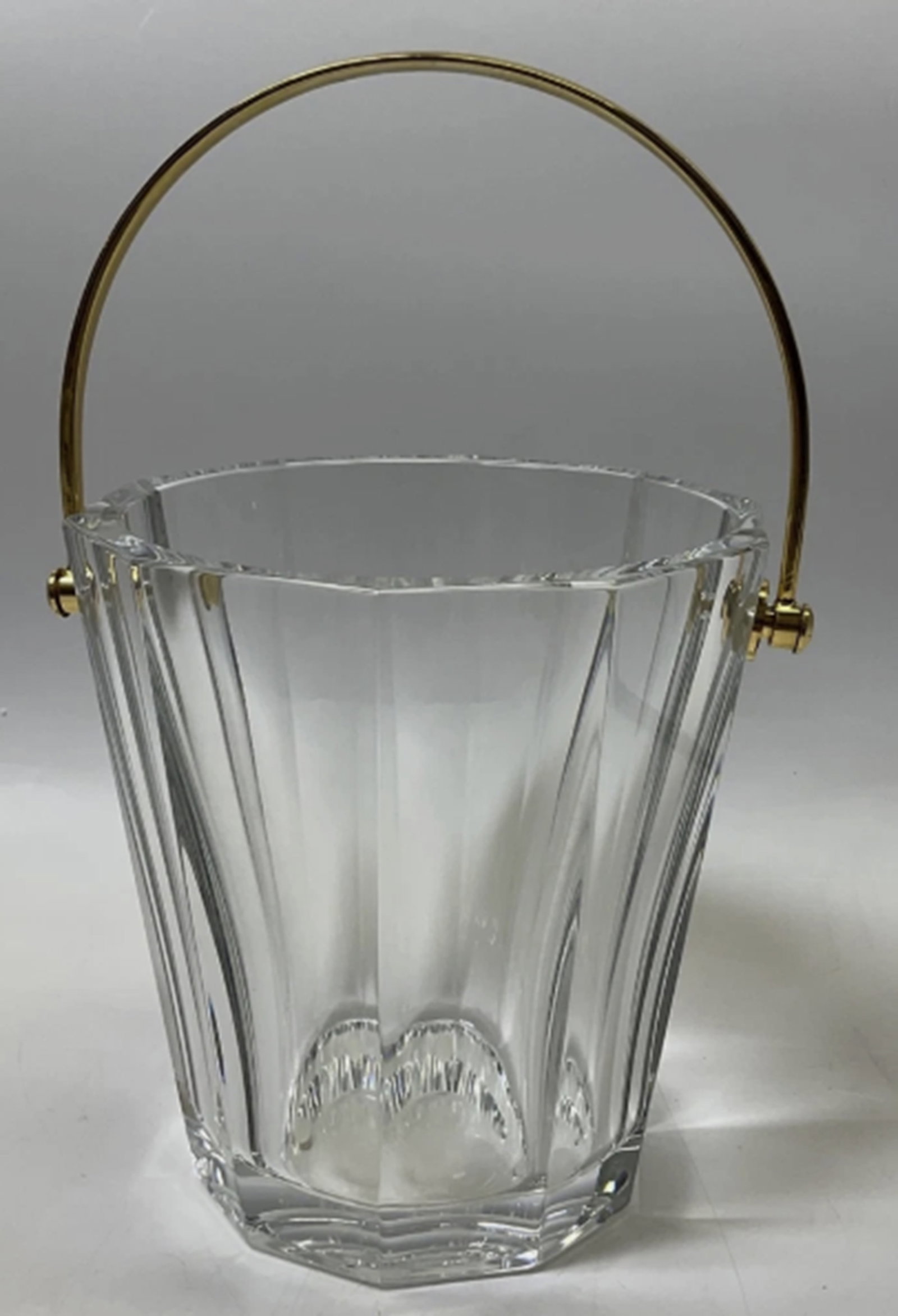 Baccarat Signed Crystal Decagon Ice Bucket With Brushed Gold Handle Made in France: Baccarat Signed Crystal Decagon Ice Bucket With Brushed Gold Handle Made in France. Measures approx 6 1/16 inches tall, 5 5/8 inches in diameter. no chips or crack present