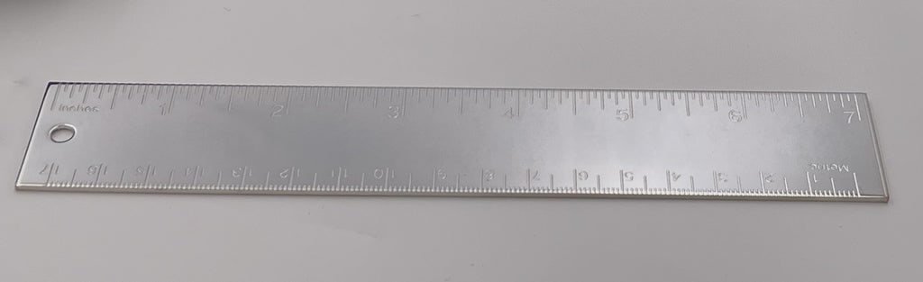 Tiffany & Co. Pair of Silver Metric Rulers in Classic Tiffany-Blue Pouches: Pair of Tiffany & Co silverplate metric rulers in brand new condition. They measure 7'' in length (17 cm) and are sold in their authentic Tiffany & Co. branded felt pouches. Perfect for a great gift! 