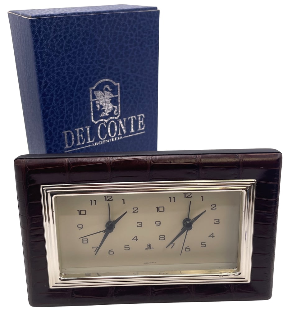Del Conte Alligator Leather and Sterling Silver Double Clock New in Box: Del Conte, Italian sterling silver and alligator leather double clock, with a wood back, in an elegant design. It measures 6 1/2'' by 4 1/4'' in height by 2'' in depth. It bears hallmarks as shown and