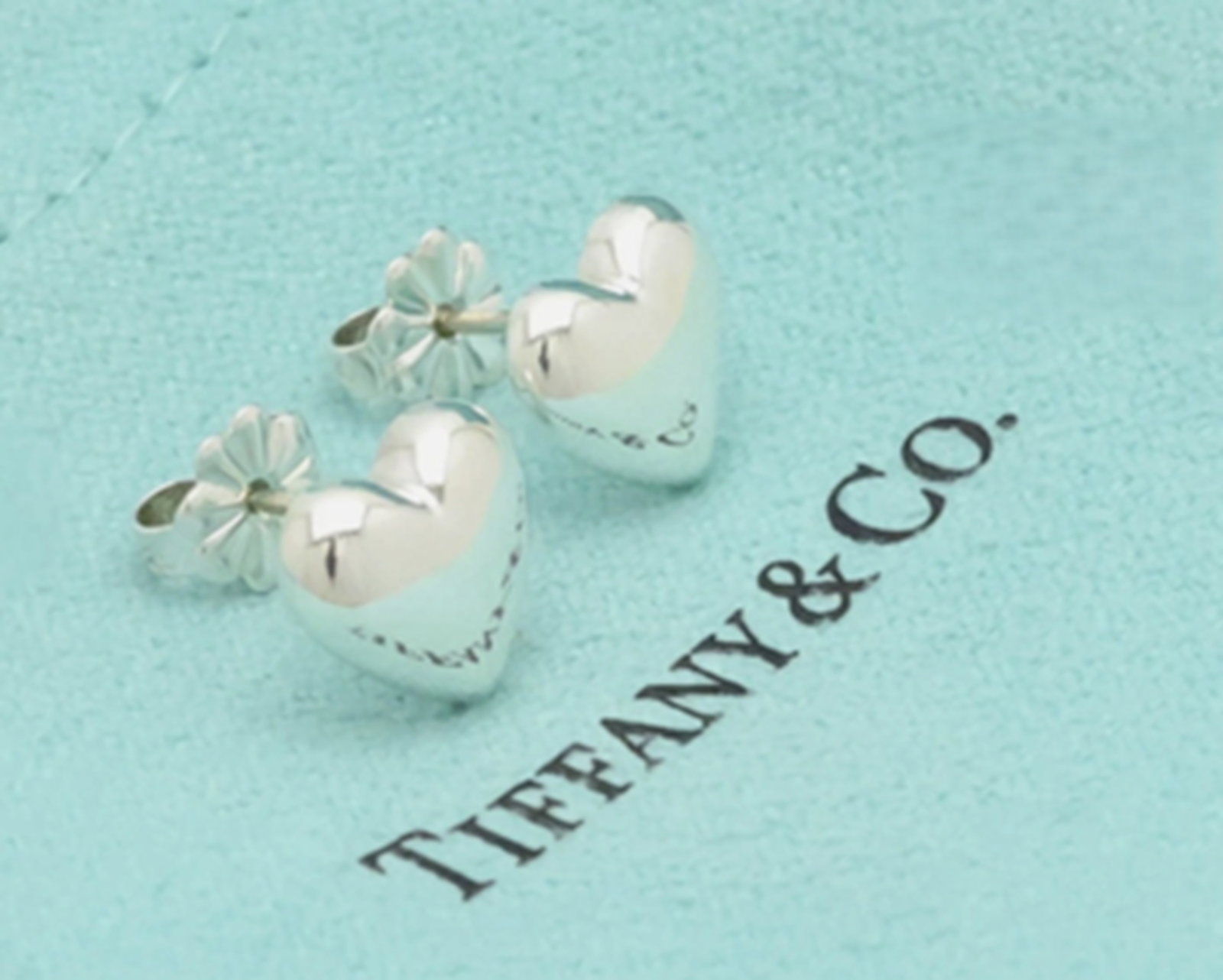Tiffany & Co Sterling Silver Puff Heart Stud Earring with Pouch: Tiffany & Co Sterling Silver Puff Heart Stud Earring with Pouch. Measures approx Approx H 0.36" × W 0.38"