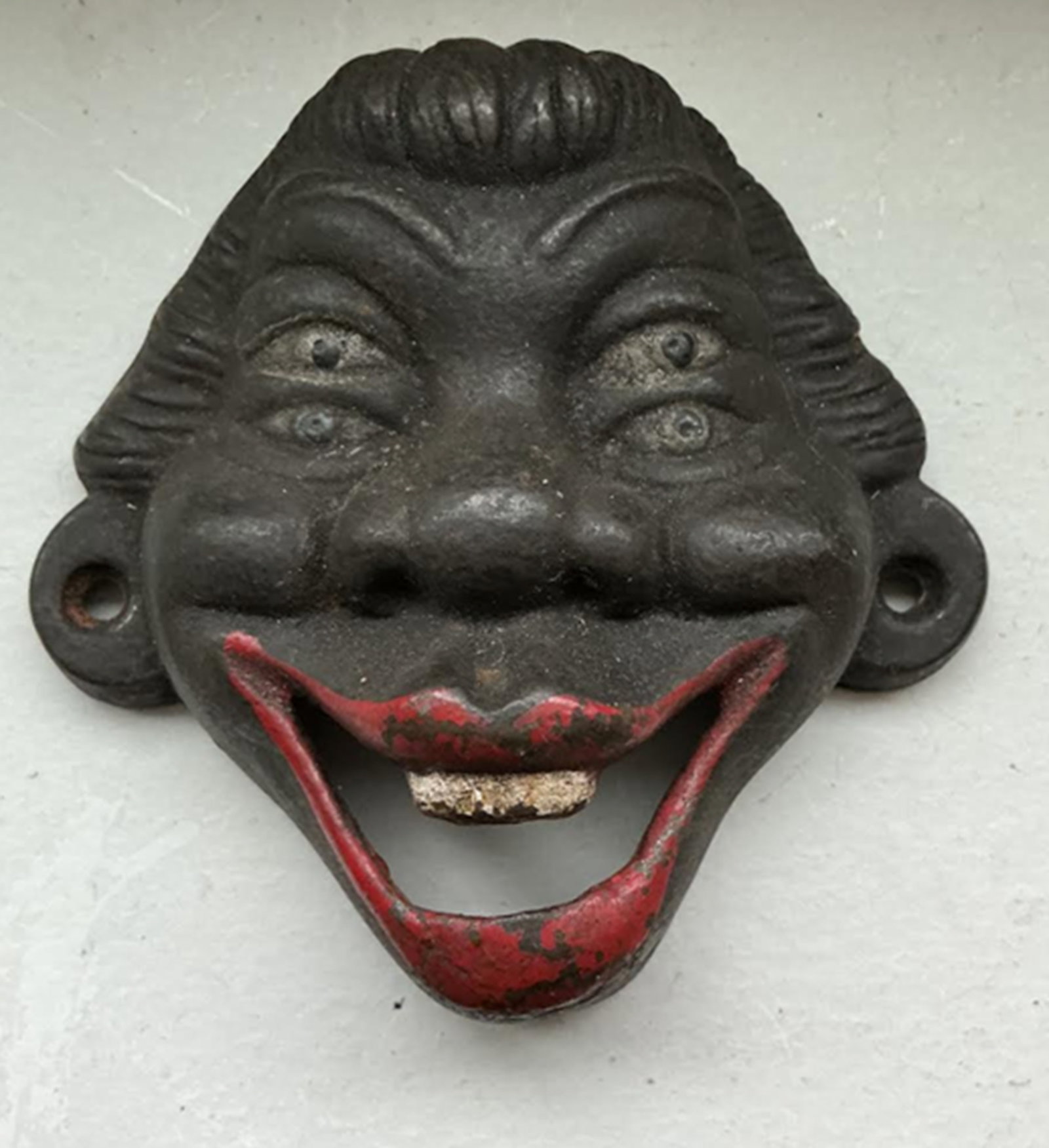 Black Americana Cast Iron Bottle Opener: Black Americana Cast Iron Bottle OpenerMeasures approx 4in x 4in
