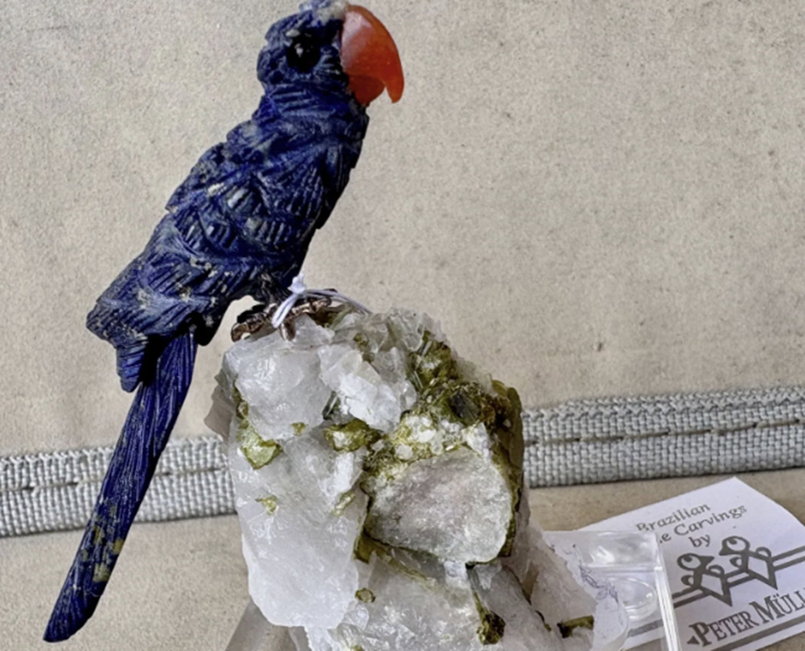 Lapis Lazuli Macaw Bird figurine on Tourmaline Quartz Crystal By Peter Muller: Lapis Lazuli Macaw Bird figurine on Tourmaline Crystal By Peter Muller. This Macaw is carved from fine Lapis Lazuli highly valued since the ancient Egyptians Fine carving and composition. The stones a