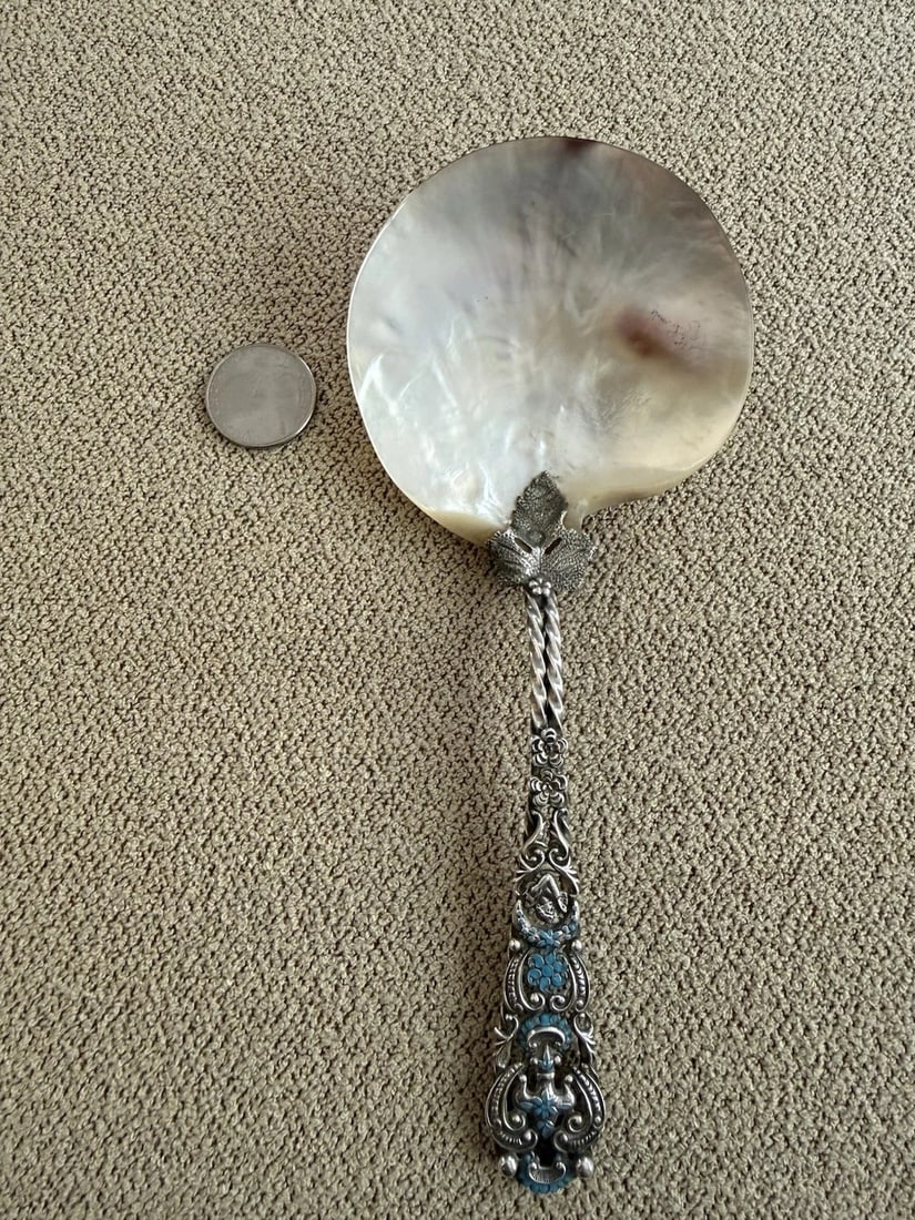 Mother Of Pearl And Sterling Silver Serving Spoon: Mother Of Pearl And Sterling Serving Spoon. Excellent condition...rare find. Approx. 7 3/4''... bowl is about 3 1/4"" by 3 1/4'' irregular shape. Very exciting piece...mother of pearl in super conditi