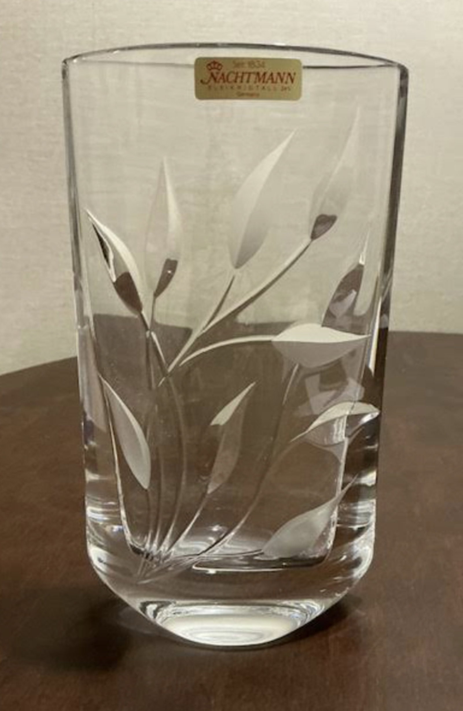 Nachtman Crystal floral designed vase with Sticker: Nachtman Crystal floral designed vase with Sticker. Measures approx 9 inches tall and 5 inches wide