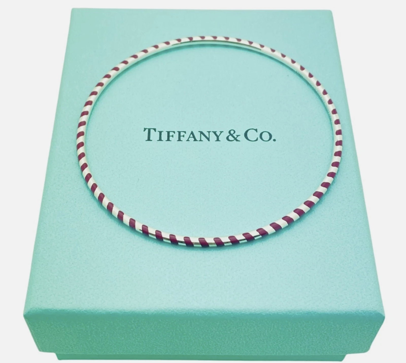 Tiffany & Co. Sterling Silver Paloma Picasso Red Enamel Stripe Bangle Bracelet With Box: Tiffany & Co. Sterling Silver Paloma Picasso Red Enamel Stripe Bangle Bracelet With Box. Size: 2.5" interior diameter and approx. 7" interior circumference; approx 2mm wide.Hallmarks: Tiffany & Co. 92