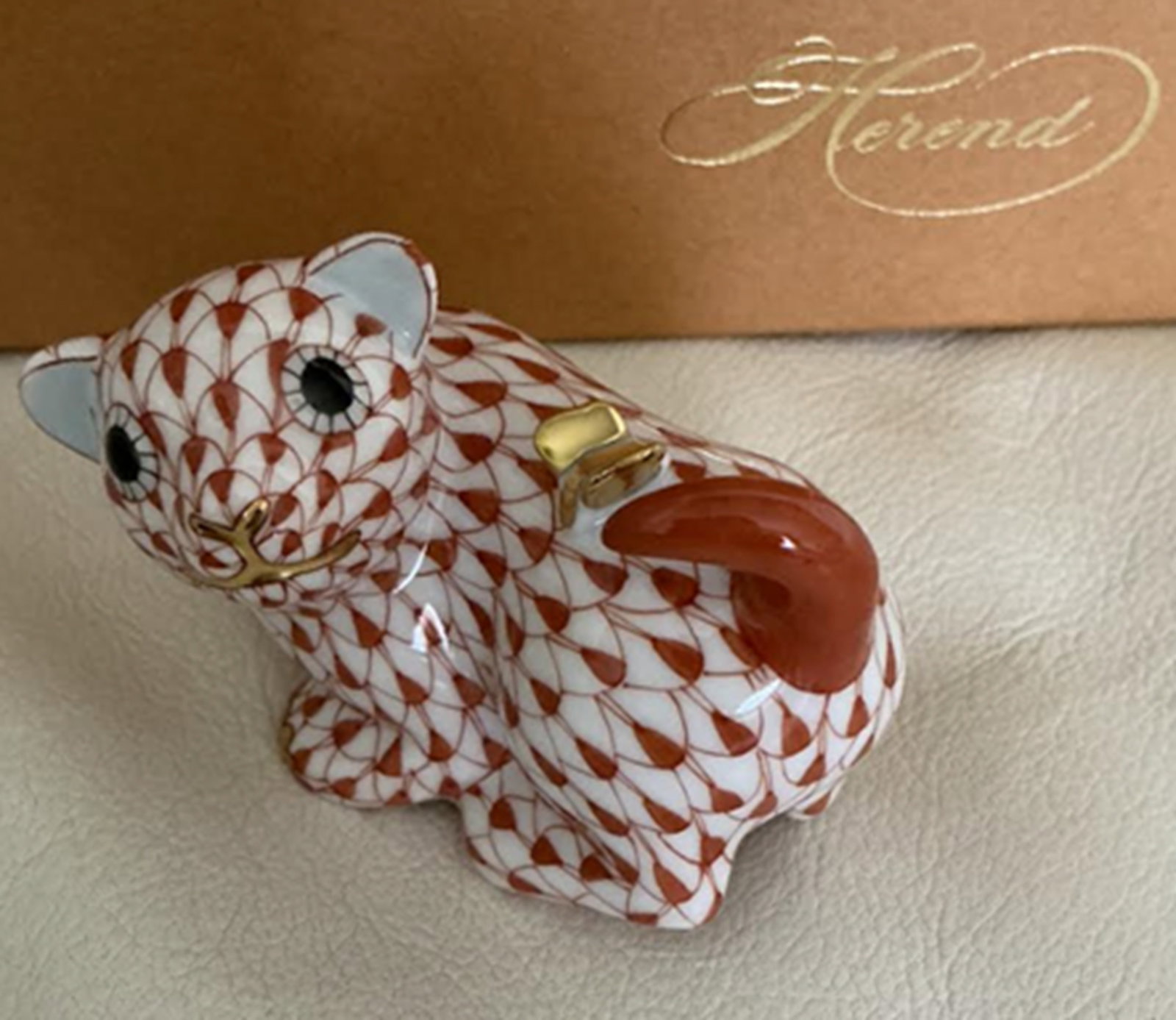 Herend Signed Porcelain Rust Fishnet Dog Figurine with 24k Gold Accents Made in Hungary.: Herend Signed Porcelain Rust Fishnet Dog with 24k Gold Accents Made in Hungary. Measures approx 2.5 inches wide and 2 inches Tall No chips or cracks present