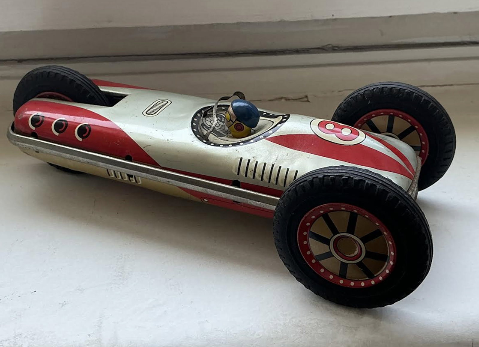 Masudaya Japanese Tin Friction Roll Over Race Car Vehicle 1950's TM: 1950's TM Masudaya Japanese Tin Friction Roll Over Race Car Measures approx 8.5x3.5. Two toned gold and silver. Wheels spin well. Toy in very good condition