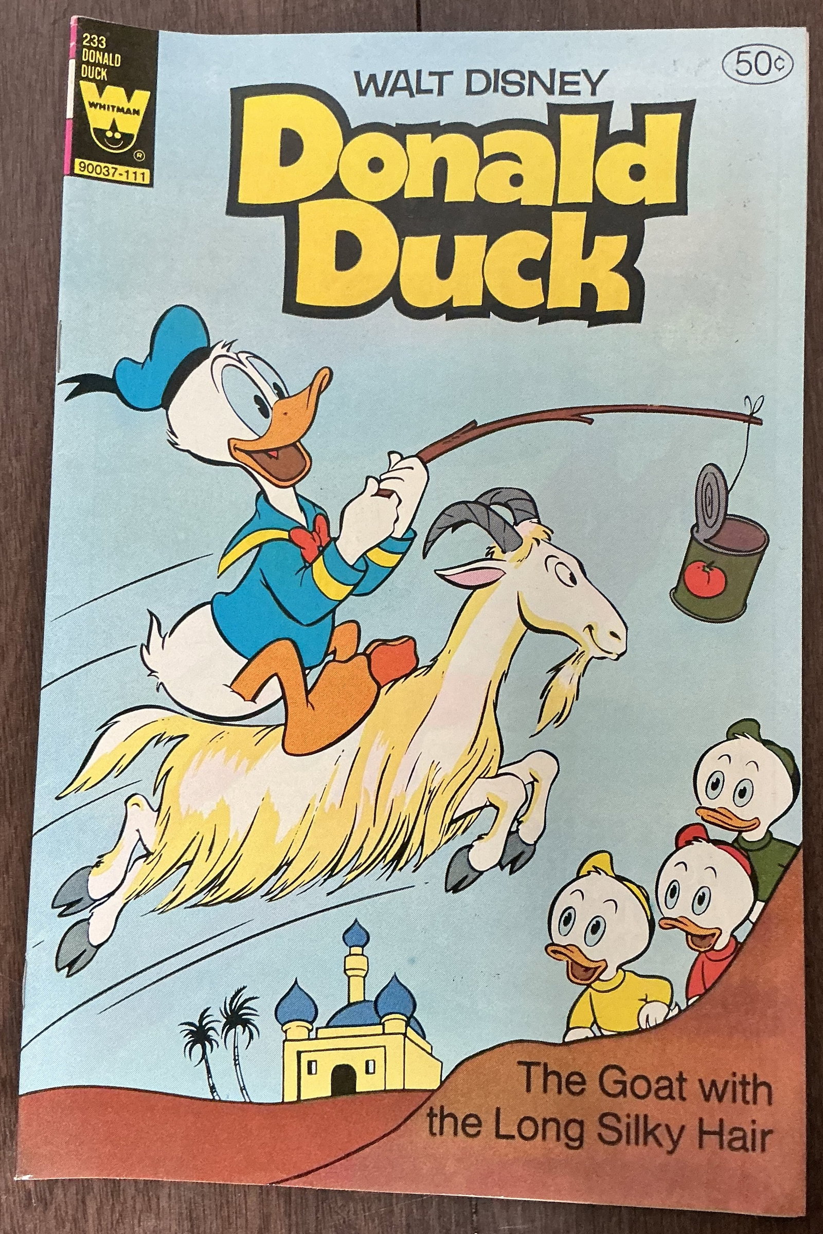 Walt Disney 1967 Donald Duck The Goat with the Long Silky Hair No. 233: Walt Disney Donald Duck The Goat with the Long Silky Hair No. 233 is a vintage Whitman Disney comic featuring Donald Duck alongside Huey, Dewey, and Louie in one of the classic adventure-style stories