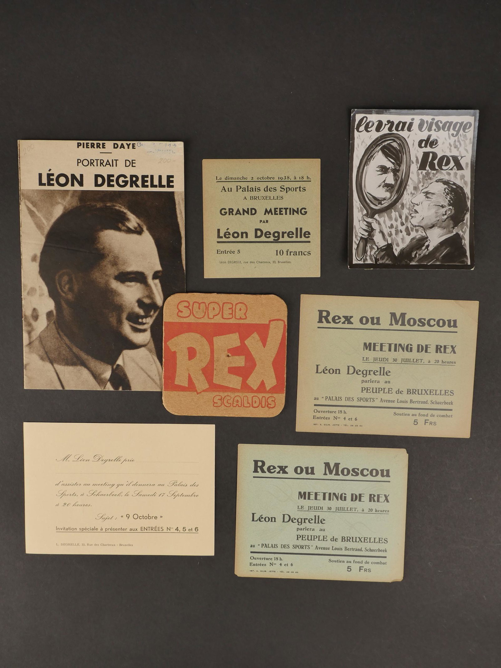 Ensemble de cartes de membres de REX. REX membership card set.: Ensemble de cartes de membres de REX. Comprenant un sous boc de biere marque REX, un tract cartonne pour le meeting de Leon Degrelle en octobre 38 au Palais des Sports de Bruxelles, un carton dâ€��