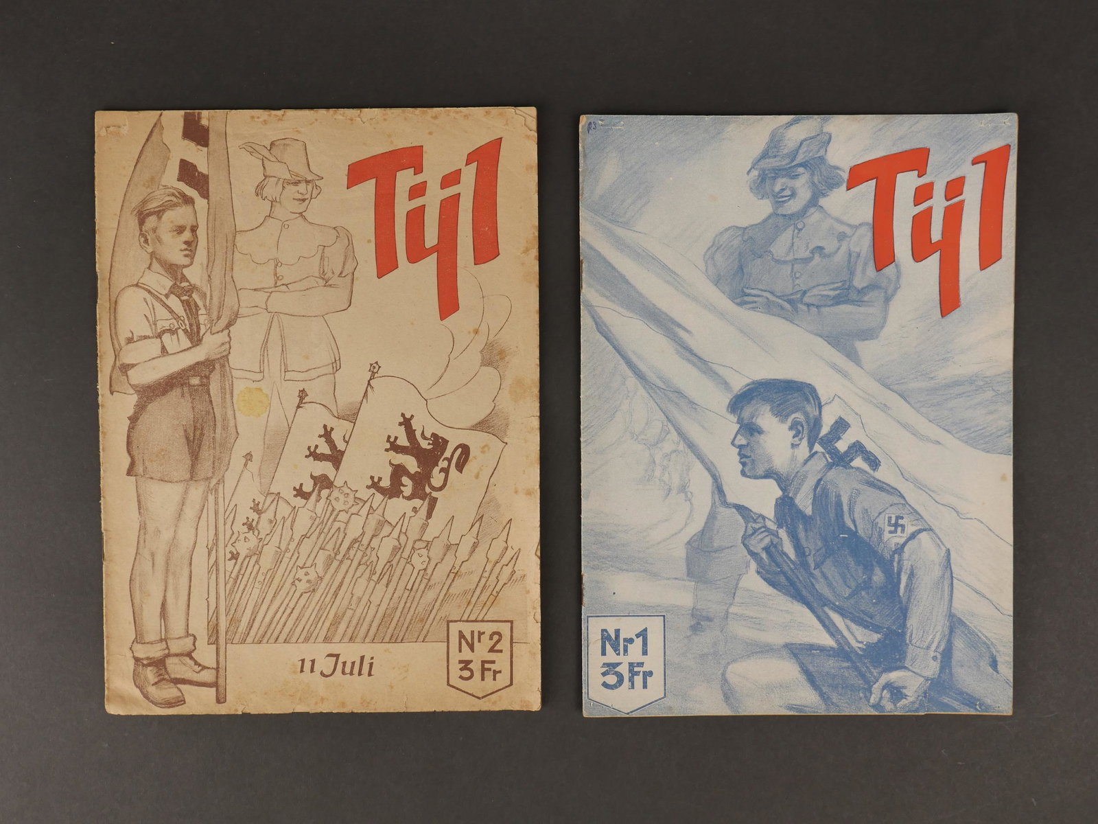 Magasine TÃ¿l. TÃ¿l magazine.: Magasines TÃ¿l. Deux magasines en papier, deux modeles differents, complets. Pour la jeunesse flamande. Couvertures presentant des taches et des marques d usures, ainsi que des manques. A noter une 