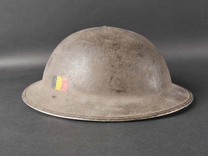 Casque de la Brigade Piron. Helmet of the Piron Brigade: Casque de la Brigade Piron compose d’une coque de casque MKII en metal sans marquages visibles. La coiffe est complete avec son cordon de serrage et porte la date 1942. La jugulaire en toile MK III