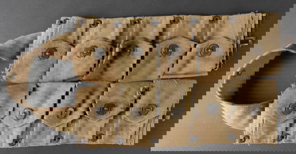 Ceinturon Garand. US Garand ammunition belt.: Ceinturon Garand en toile epaisse de teinte OD3, avec un beau marquage US visible au niveau de la premiere pochette pour munitions. Les boutonpression sont presents et fonctionnels. La bouclerie est