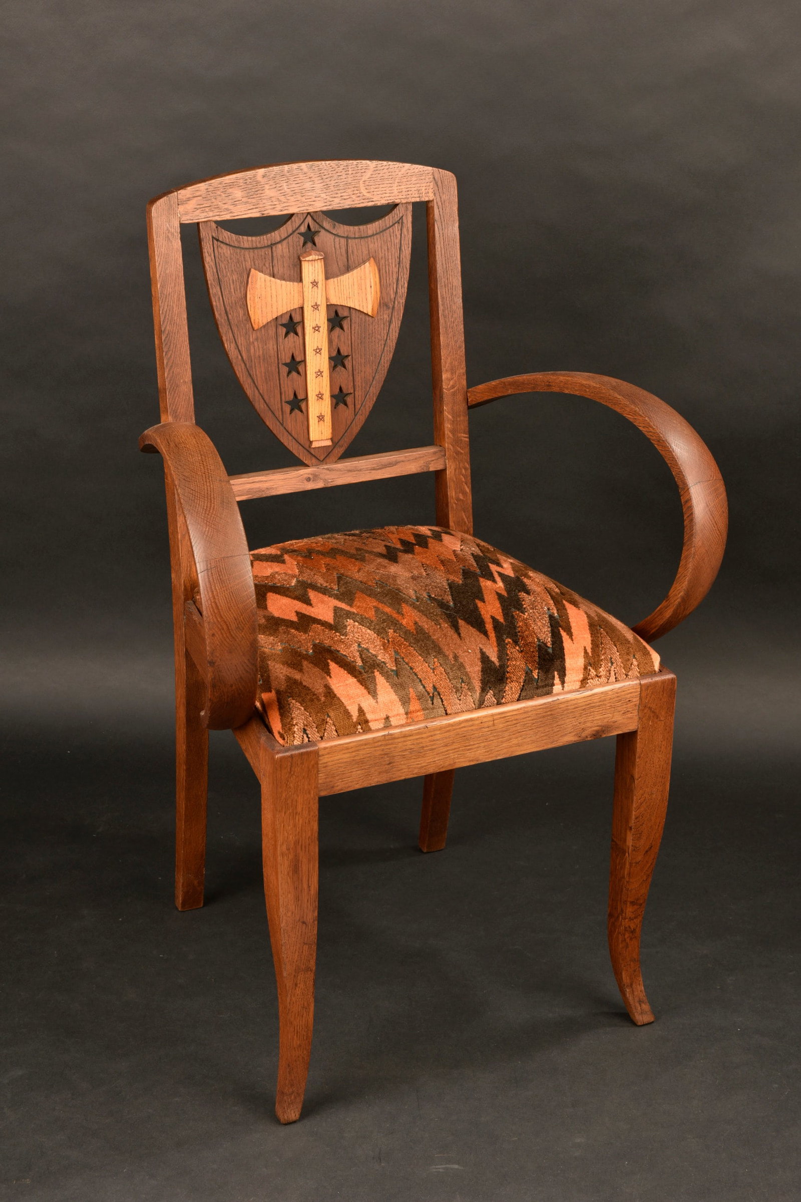 Fauteuil provenant de lhotel du parc. Armchair from the Hotel du Parc.: Fauteuil provenant de lhotel du parc. Fauteuil dontle dossier est decoree dun ecu orne dune francisque et des sept etoiles de Marechal. Ce fauteuil se trouvait dans les salles dattentes de lhotel du p