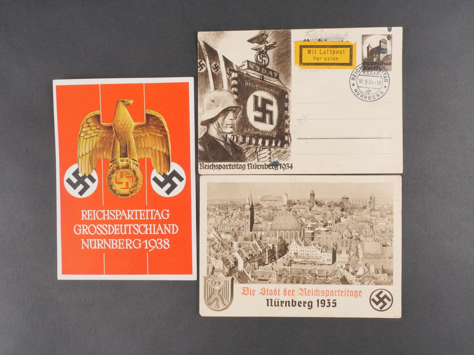 Cartes postales Reichsparteitag. Reichsparteitag Postal cards.: Trois cartes postales du Reichsparteitag, modeles differents, deux vierges. Modeles en couleur. Legere usure et patine. etat I?. Three different Reichsparteitag postcards, two blank. Color prints. Lig