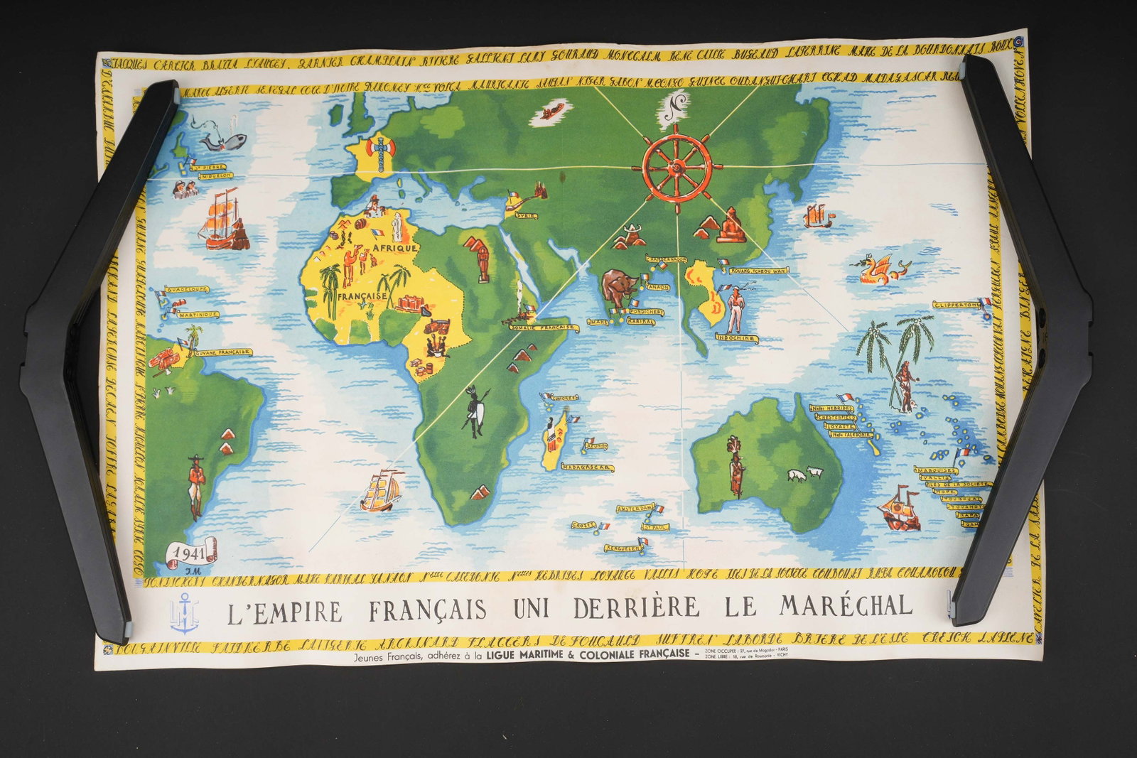 L empire francais derriere le Marechal. The French Empire behind the Marshal.: L empire francais derriere le Marechal. En papier et en couleur. Texte en francais. Jeunes francais adherez a la Ligue Maritime et coloniale francaise. Dimensions 30 x 50 cm. A noter une certaine