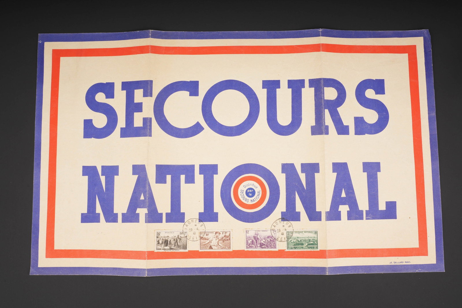Secours National. National Relief.: Secours National. En papier et en couleur. Texte en francais. Timbre de Bagneux sur Seine, obliteration du 28 avril 1941. IMP Gaillard Paris. Dimensions 30 x 50 cm. A noter une certaine usure et