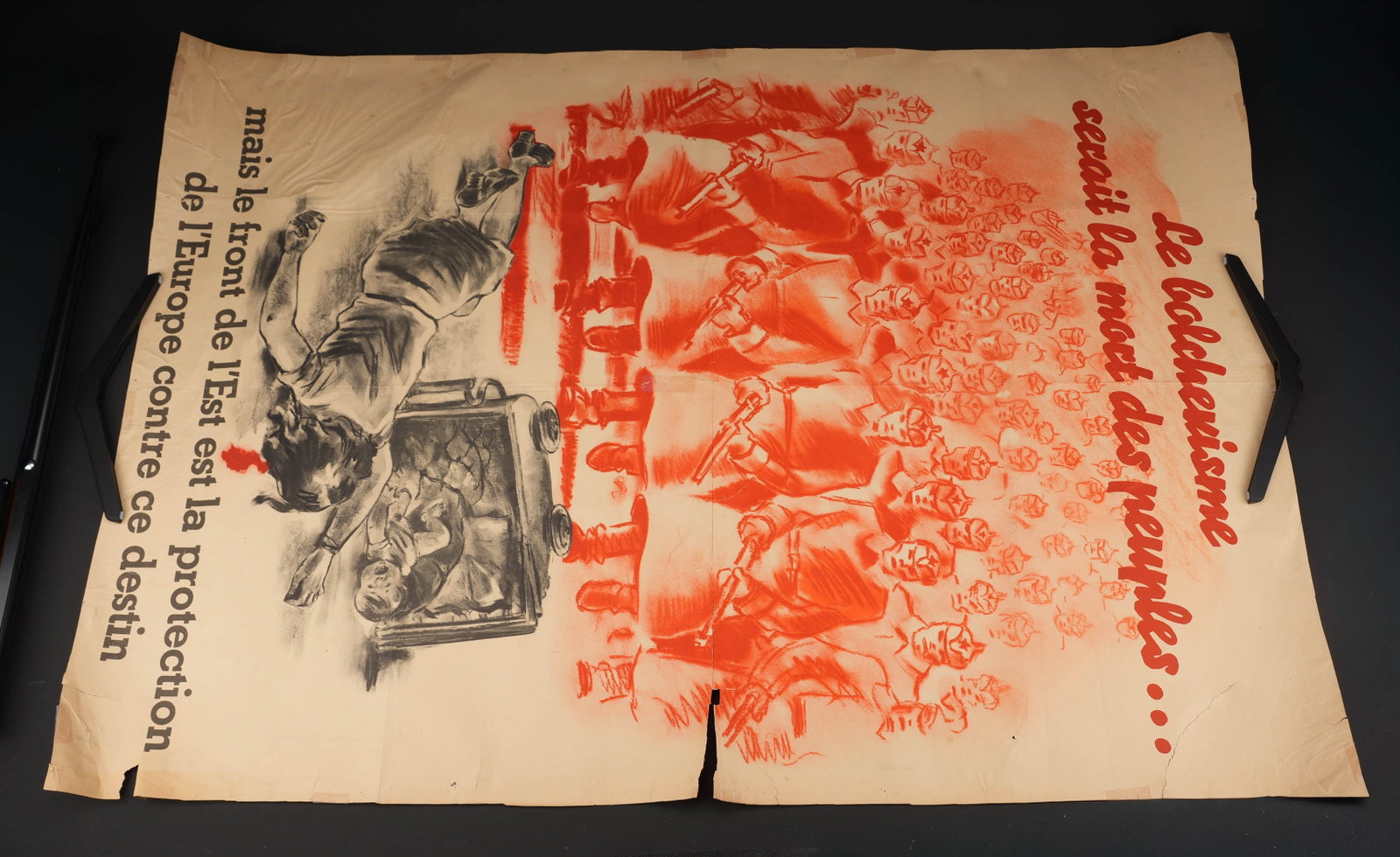 Le bolchevisme serait la mort des peuples. Bolshevism would mean the death of peoples.: Le bolchevisme serait la mort des peuples. En papier et en couleur. Texte en francais. Dimensions 130 x 90 cm. Vers 1943. A noter une certaine usure et patine de la piece, ainsi que quelques taches, d