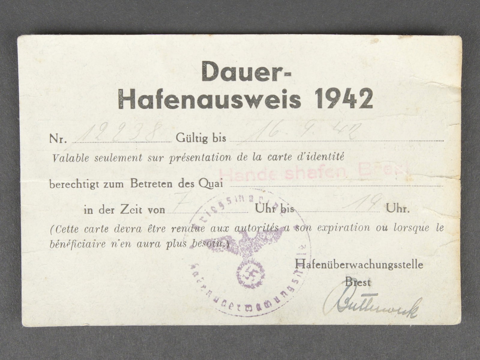 Laissez passe du Port de Brest. Brest harbour pass.: Laissez passe du Port de Brest. En papier, marque Dauer Hafenausweis 1942, numero 12238, date du 16 septembre 1942 pour le quai Hande Schafen Brest. A noter une certaine usure et patine de la piece.
