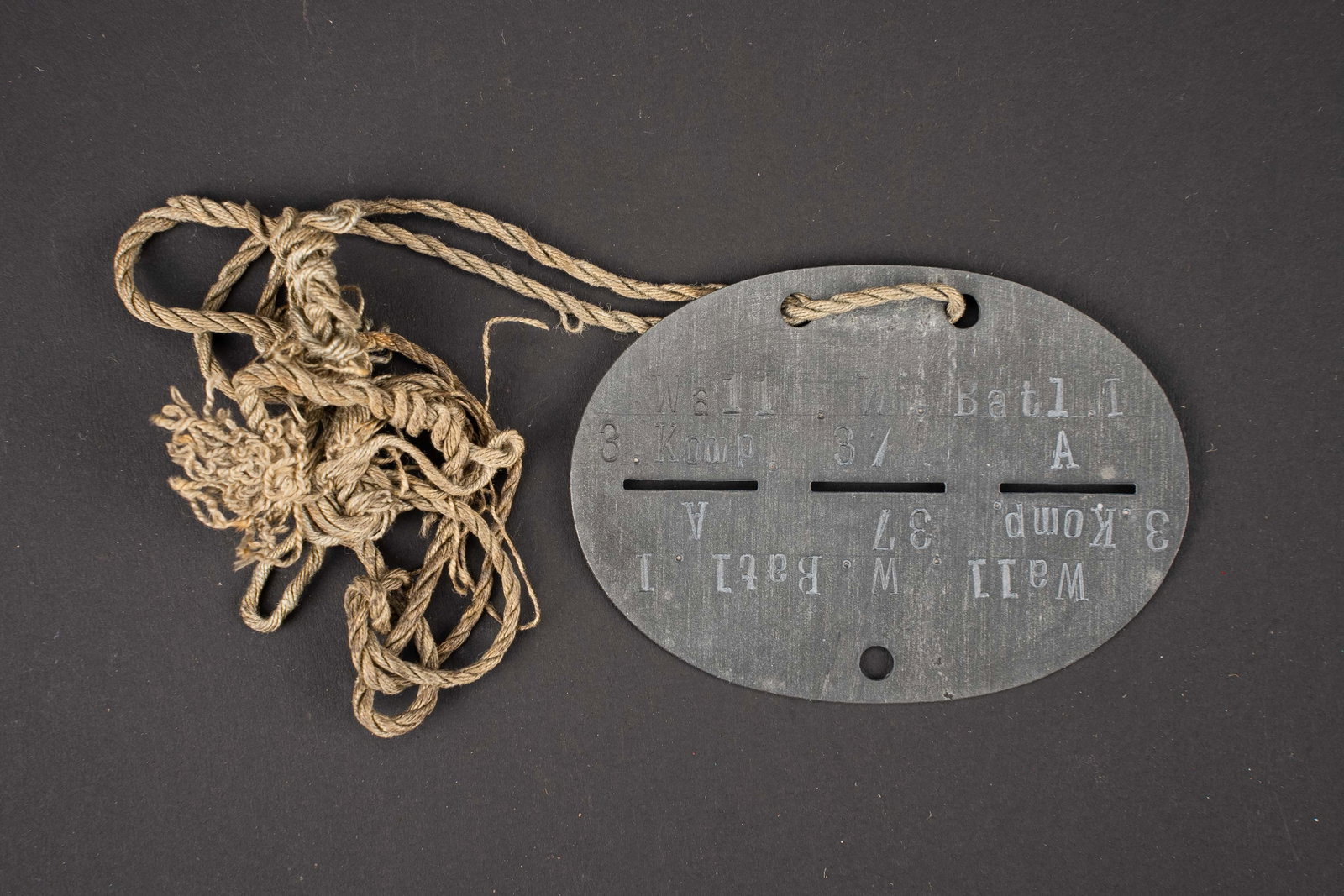 Plaque d identite Wallonie. Wallonia identification disc.: Plaque d identite Wallonie. En metal. Complete. Marque Wall W Batl I 3 Komp 37. Groupe sanguin A. Numero 37. Cordon present. Le numero 37 correspondant au Gefreiter Josephs Dohet. A noter une