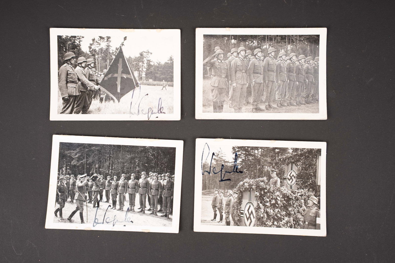 Photos Wallonie. Wallonia photographs.: Photos Wallonie avec autographe de Leon Degrelle. Quatre photos noir et blanc disposant au recto de la signature autographe de Leon Degrelle. Au verso, divers marquages dont Au petit Pierrot de la