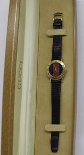 Vintage Gucci GP 3001L watch: ----DESCRIPTION---- A Beautiful Ladies Gucci Vintage Gold Tone Stainless Steel 3001L wristwatch in excellent condition. Comes with ORIGINAL Box, Papers, & leather band ----- DETAIL ----- MAKE: Gucci M