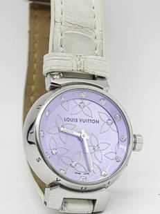 Ladies Louis Vuitton Q1210 Diamond watch: ----DESCRIPTION---- A Rare Louis Vuitton Ladies Diamond studded hour marks wristwatch, White Leather band to accent the light purple floral delicate detail of the dial. This piece comes with