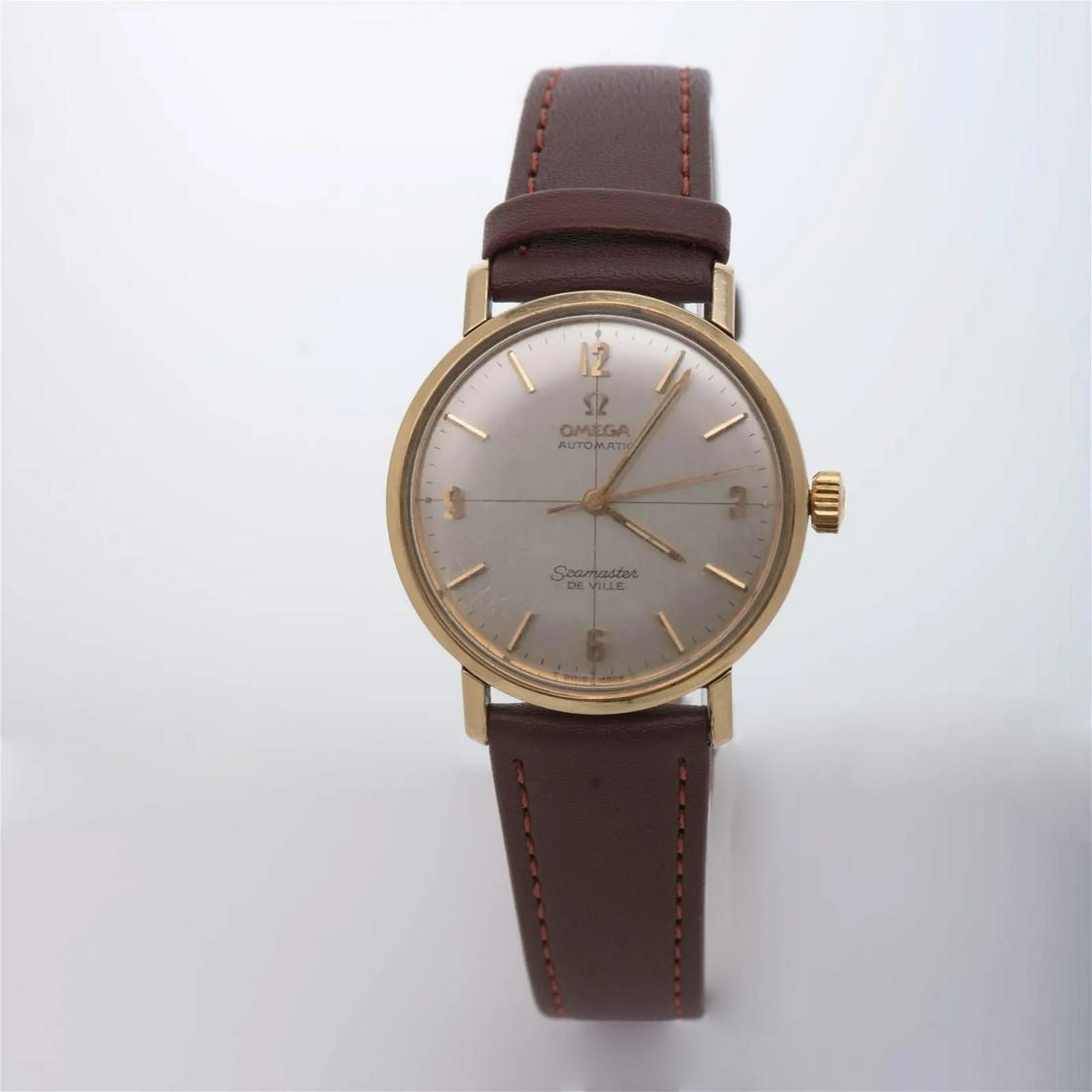 Mens SS/Gold plated Omega SeaMaster Deville watch: Brand: Omega Model: SeaMaster Deville Case size:36mm Case Material: Gold Plated Stainless Steel Movement: Automatic Bezel: gold Dial: Antique Silver Bracelet: Brown Leather Clasp: gold plated stainles