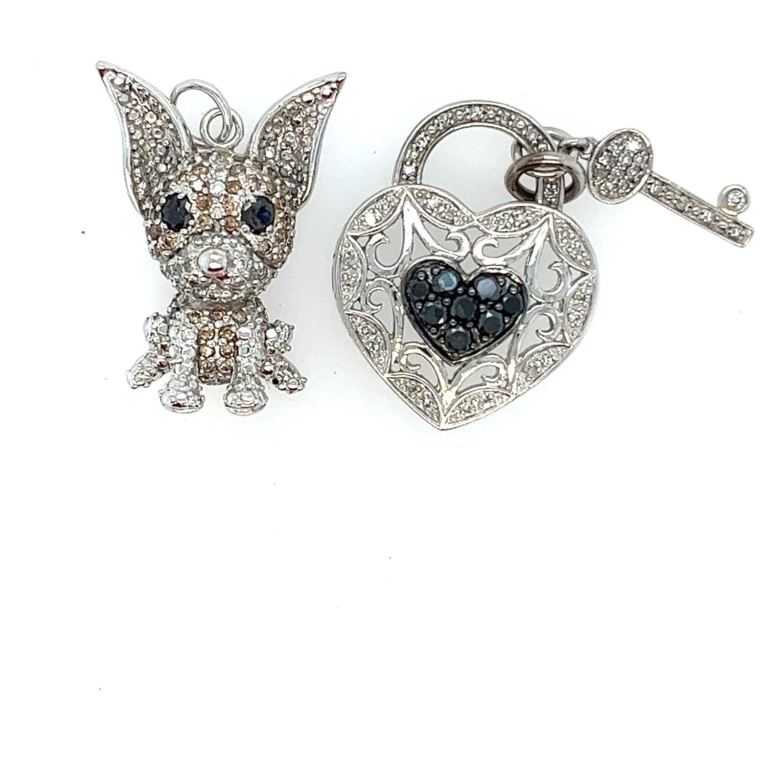 10 k Diamond & Sapphire Heart & Animal Pendant set: If you like fun and quirky jewellery these pendants are for you. Crafted of 10k white gold and inlaid with diamonds and sapphires. The first is a cute chihuahua dog with sapphires for eyes. The second