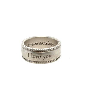 Tiffany & Co 925 Silver I Love You Band: Tiffany & Co 925 Sterling Silver band with I love you engraved across the front. Inside of ring is stamped with Tiffany trademark and AG925. Total weight is 7.6 grams.