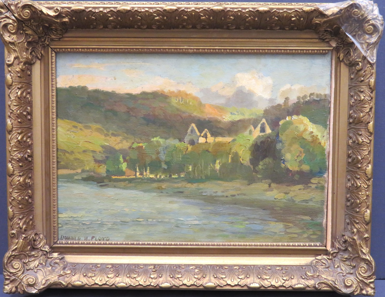 Donald Henry Floyd, British, (1892-1965): Oil on canvas titled "Tintern Abbey" showing the settlement hugging a river bend. Signed l/l, image size: 10''x14'' (Requires new frame, current frame size: 14-1/2''x18-1/2'').