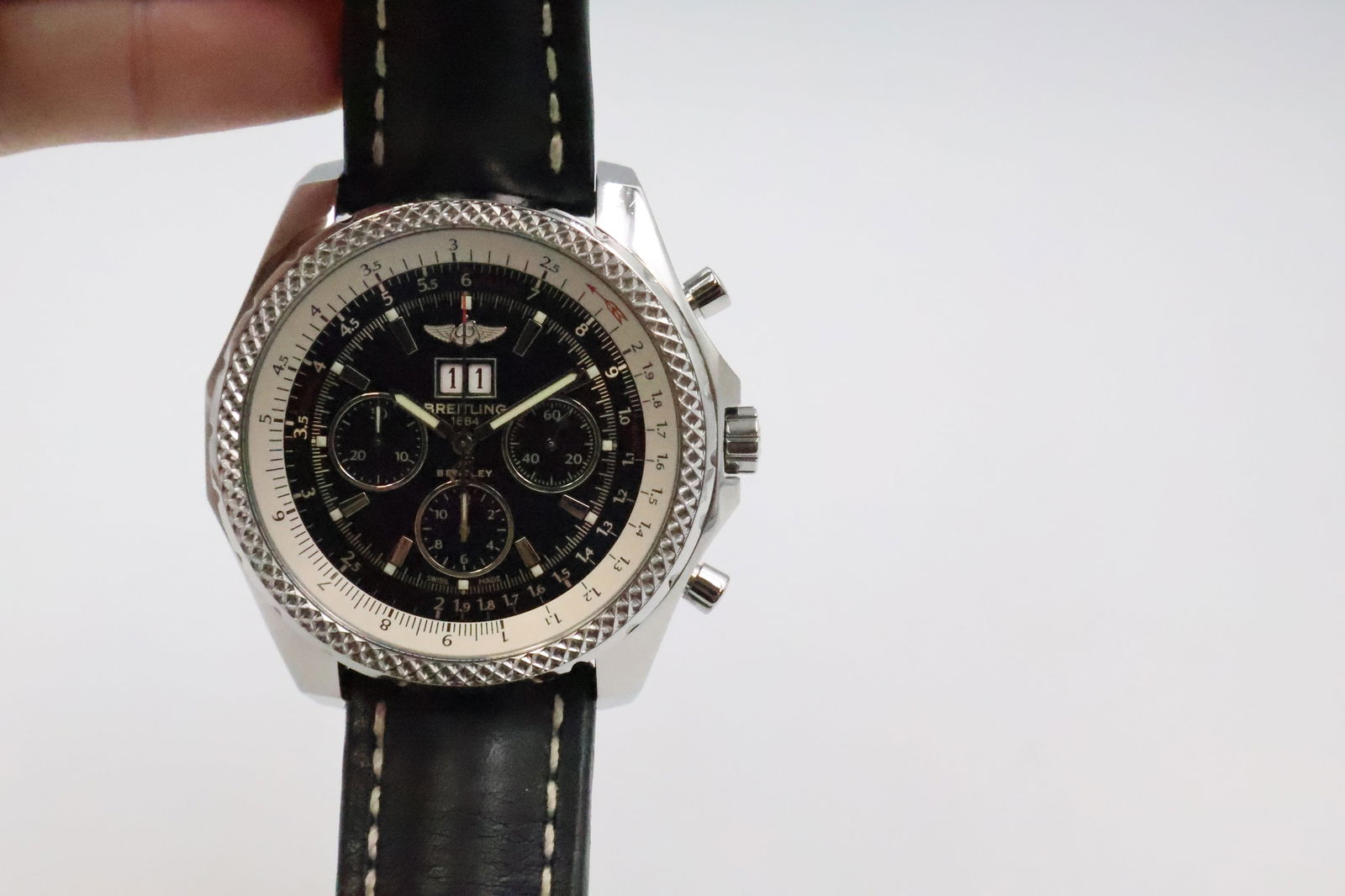 Breitling Bentley: Breitling Bentley Men's Watch. Stainless steel case and bezel. Blue dial with silver-tone luminescent hands and index hours markers. Date aperture between the 4 and 5 o'clock position and chronograph